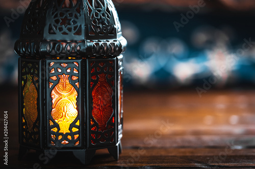 The Muslim feast of the holy month of Ramadan Kareem. Beautiful background with a shining lantern Fanus.