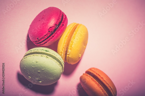 Close up colorful macarons dessert with vintage pastel tones photo