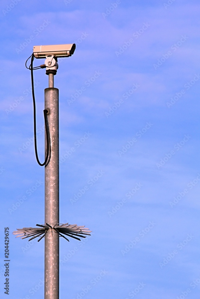 security camera on a metal pole