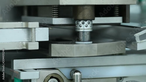 Pills manufacturing machine at pharmaceutics factory