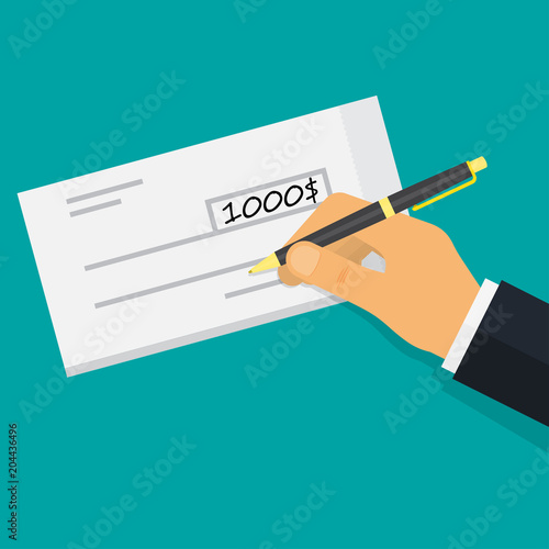 Hand holding pen filling a cheque.