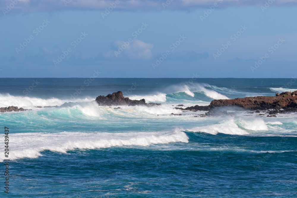Waves Crashing Ashore Along the Scenic Maui Coast