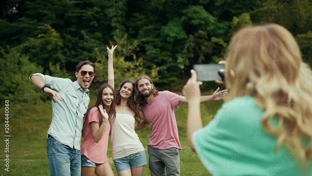 Happy Friends Taking Photos On Phone In Nature. Happy Friends Taking Photos On Phone In Nature.