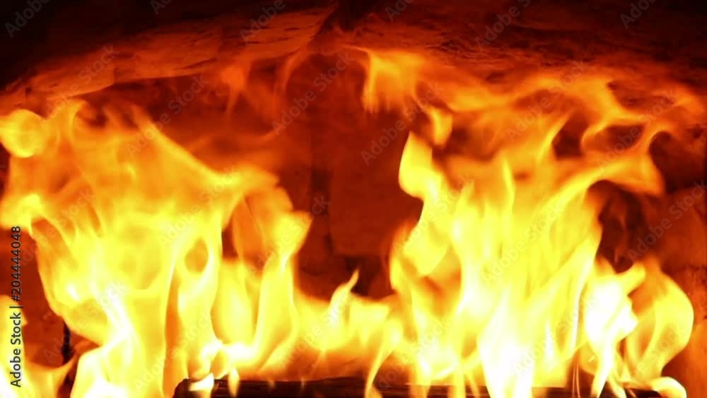 Fire burning in the furnace, close-up. Fire burning in the furnace, close-up.