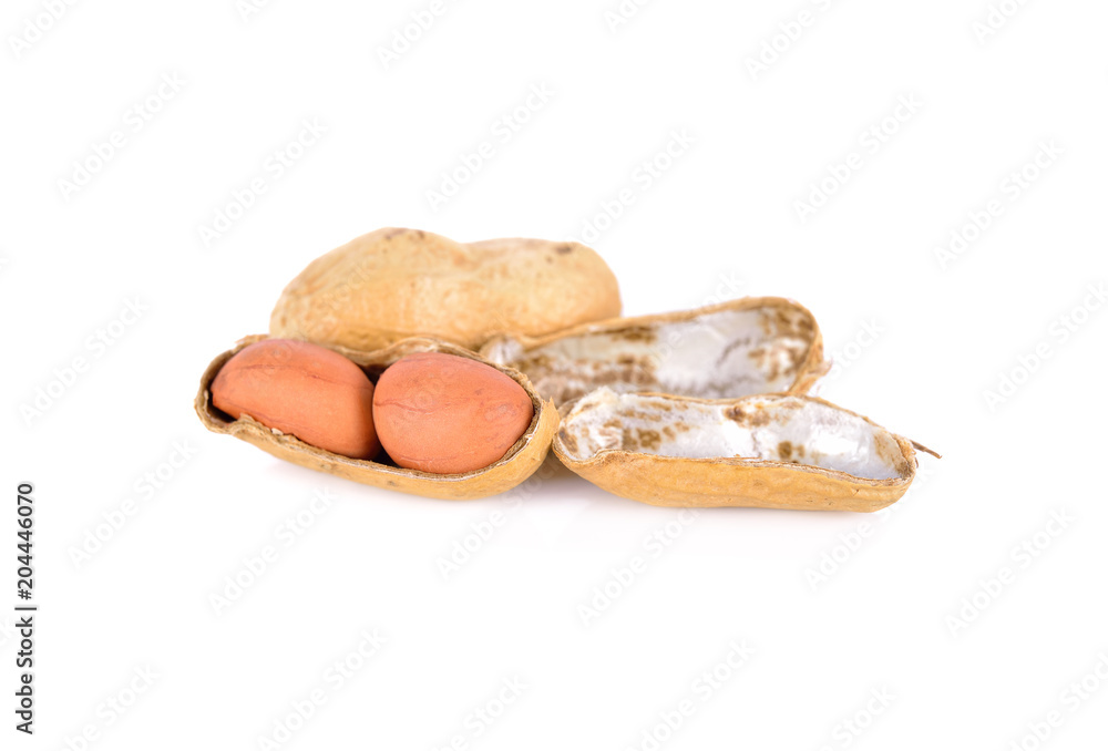 whole and peeled roasted peanut on white background whole and peeled roasted peanut on white background