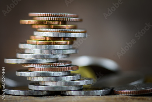 Closeup strack of money coins with differrent position wording BONUS , Idea  for money and business concept. photo