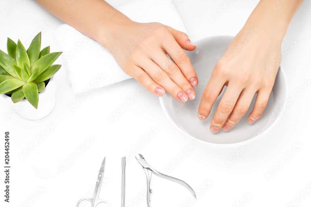 Naklejka premium Beautiful woman hands. Spa and manicure. Soft skin, the concept of nail care.