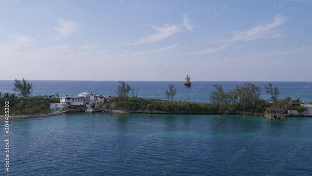 Bahamas and container ship behind them Bahamas and container ship behind them