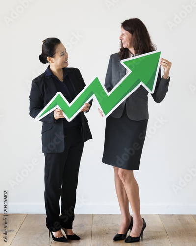 Businesswomen holding profit statistics icon photo