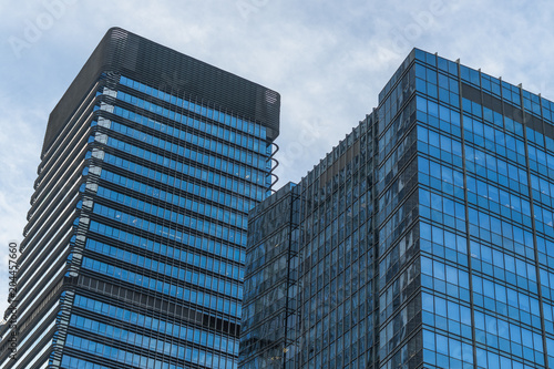 Modern office building against blue sky.