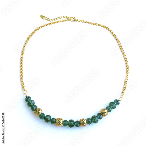 Handmade necklace from green beads and gold chain.