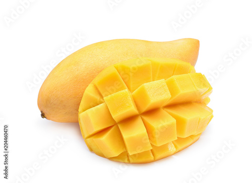 whole of ripe mango with cube isolated on white background