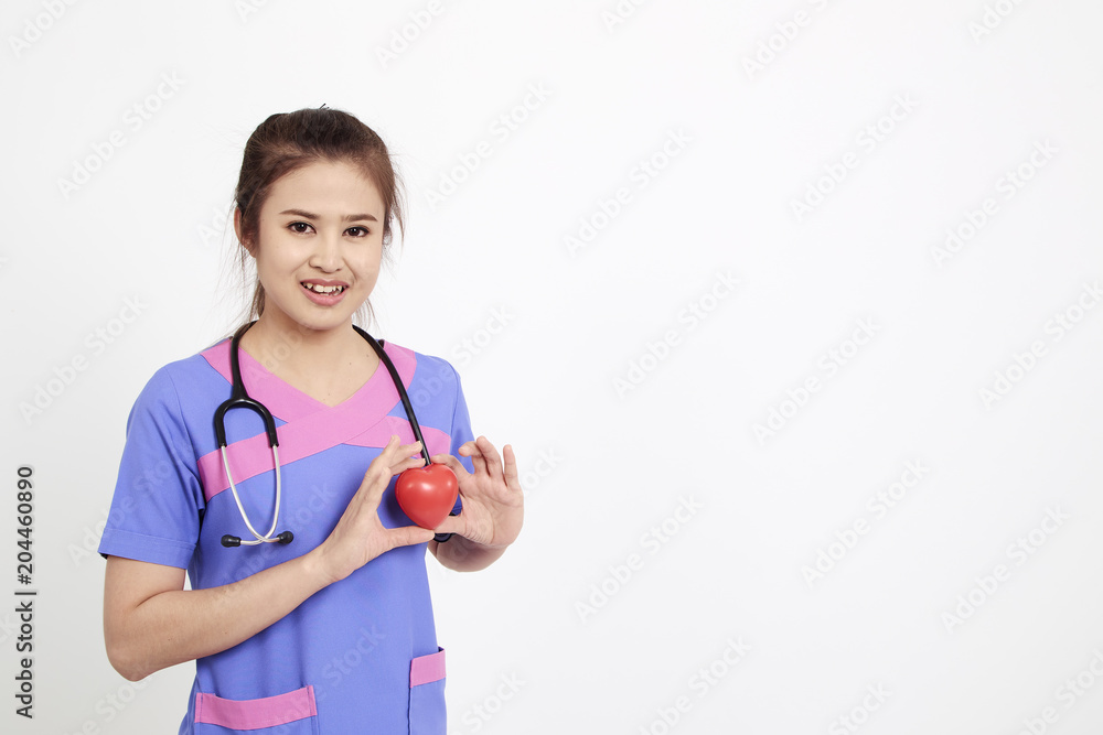 Female doctor with stethoscope holding heart Female doctor with stethoscope holding heart