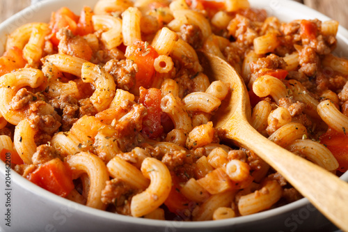 Homemade American goulash with elbow pasta, beef and tomatoes close-up. horizontal