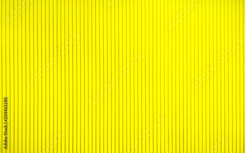 abstract background concept,close up beautiful texture yellow wall and simple design of straight line for interior decorative,wooden material wallpaper of modern style,copy space and pattern orderly
