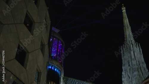 Haas Haus building and Stephansturm at night photo