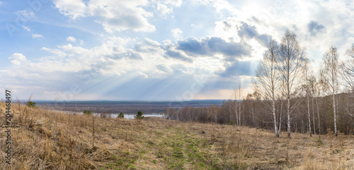 Road and sunlight over the Oka river