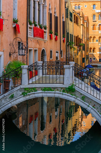 Weathered building facade on a picturesque canal in Venice Italy © SvetlanaSF