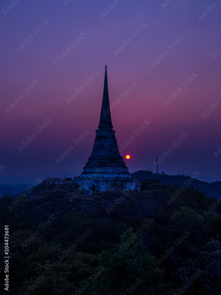 sunset behind pagoda ovr the mountain