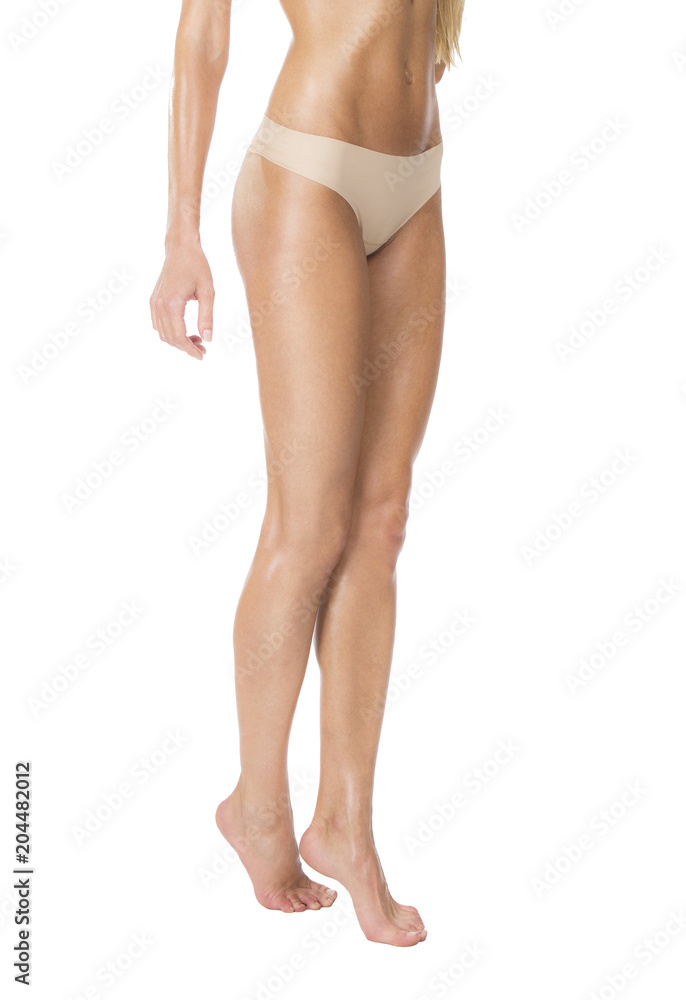 Healthy woman's legs in beige thongs, isolated shot