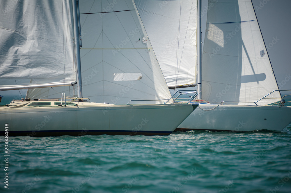 Classic sailing boats racing at a regatta at lake constance Classic sailing boats racing at a regatta at lake constance