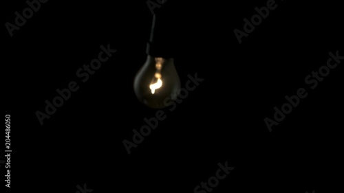 Wallpaper Mural Light bulb swinging to camera in slow motion 4k Torontodigital.ca