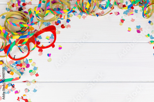carnival party background with confetti and streamer