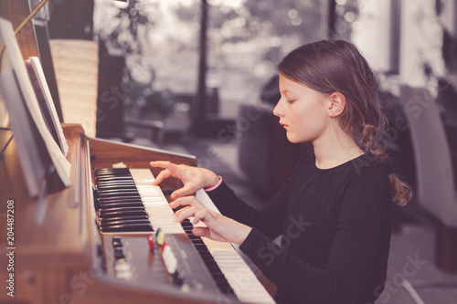 Young girl playing organ