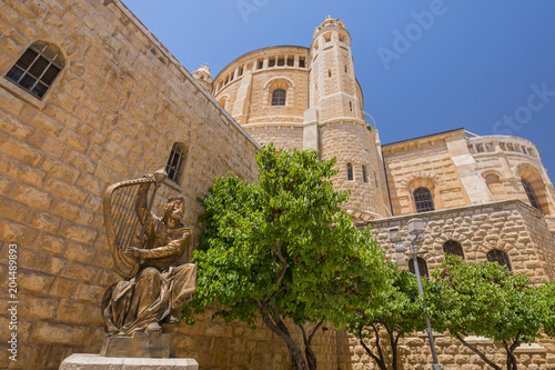 King David of Israel playing the harp. Statue located near the entrance to the king David's Tomb on Mount Zion in Jerusalem, Israel. photo