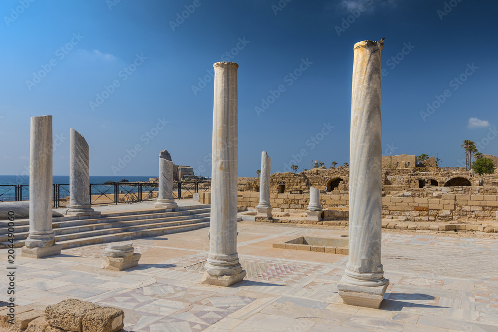 Roman old marbe column square in Caesarea Archaeological site, Israel.