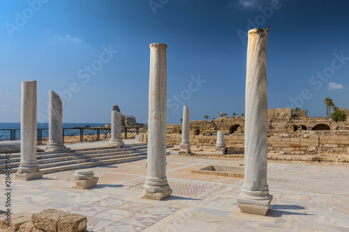 Roman old marbe column square in Caesarea Archaeological site, Israel.