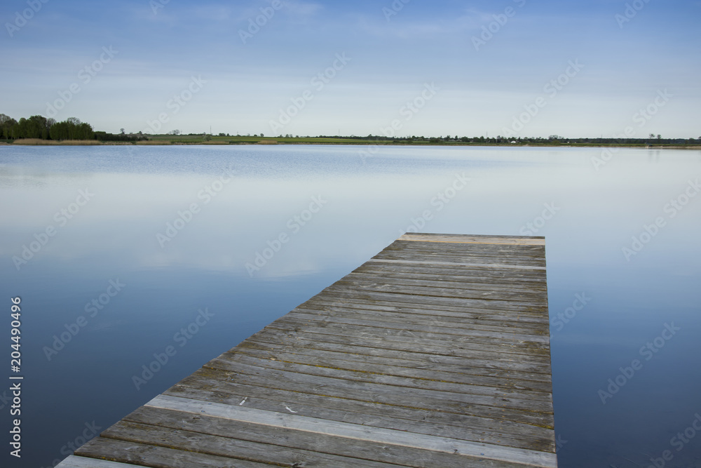 Wooden deck from planks towards the water
