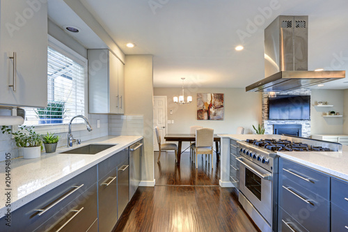 Stylishly updated kitchen with stainless steel appliances.