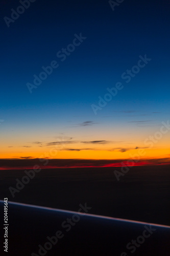 Sunrise from a airplane © rninov