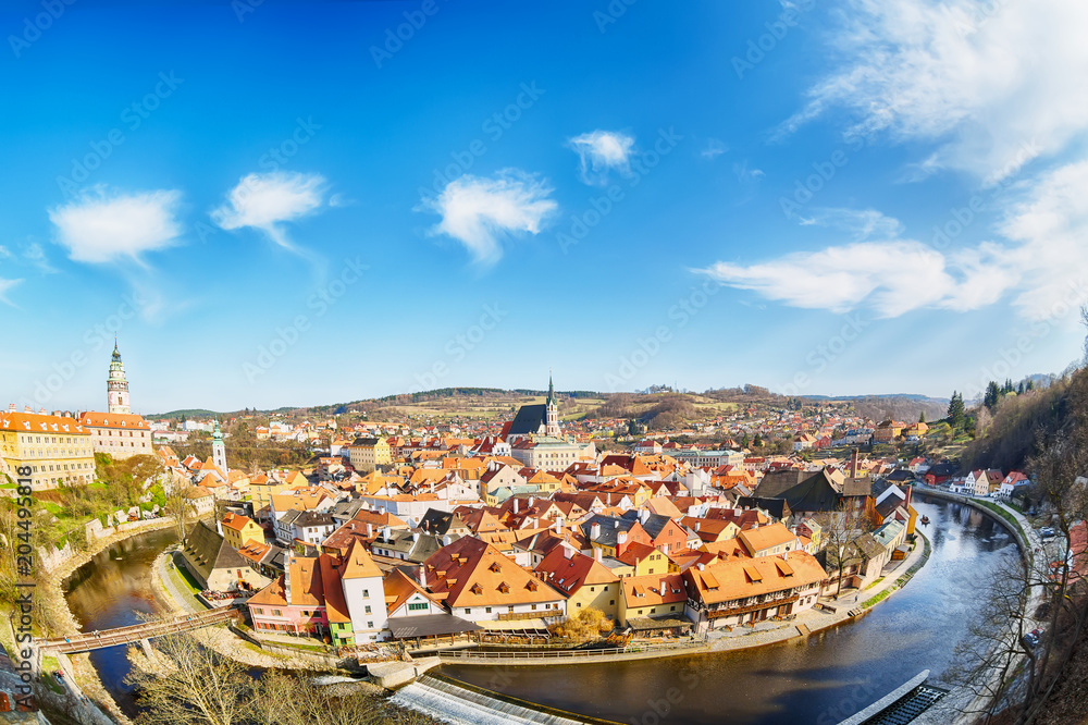 Aerial view panorama of the old Town of Cesky Krumlov in South Bohemia, Czech Republic with blue sky. UNESCO World heritage Site and famous place for tourism