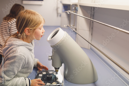 Two young girls working in a resarch centre for children photo