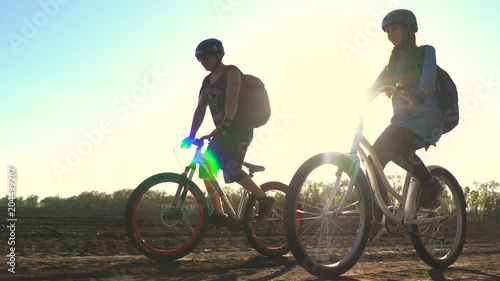 Wallpaper Mural Slow motion shooting as a man and a woman riding a bicycle on a sunny day Torontodigital.ca