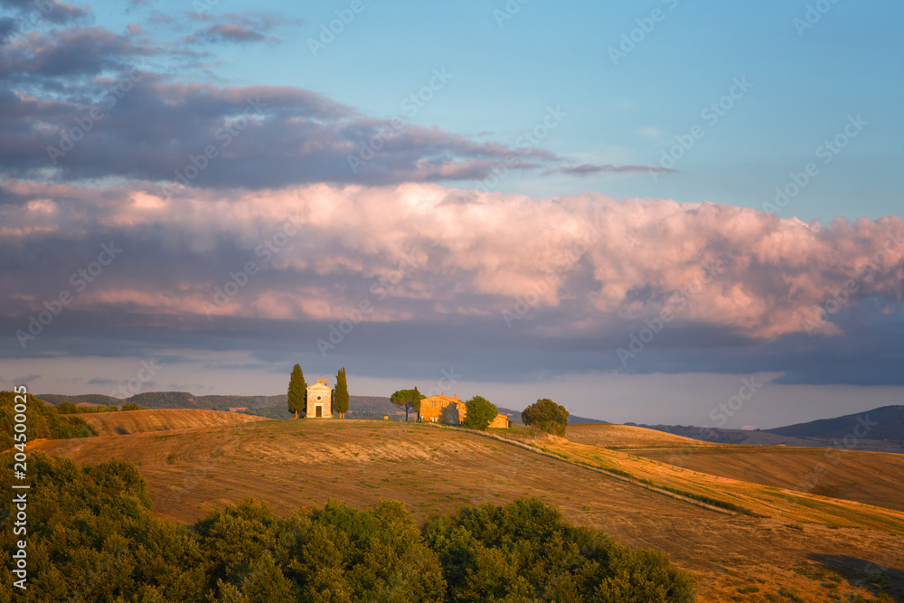 Sunset and a small old chapel in Tuscany, Italy