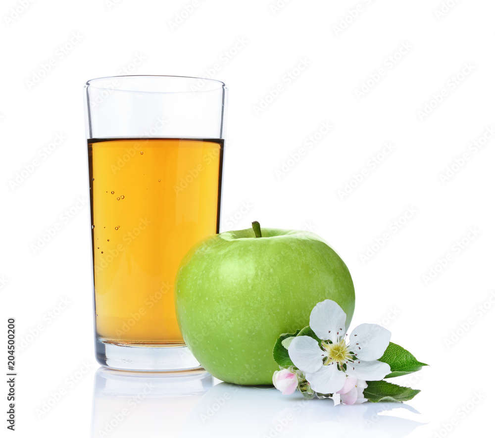 Glass of fresh organic juice and green apple with leaves and spring flowers Glass of fresh organic juice and green apple with leaves and spring flowers