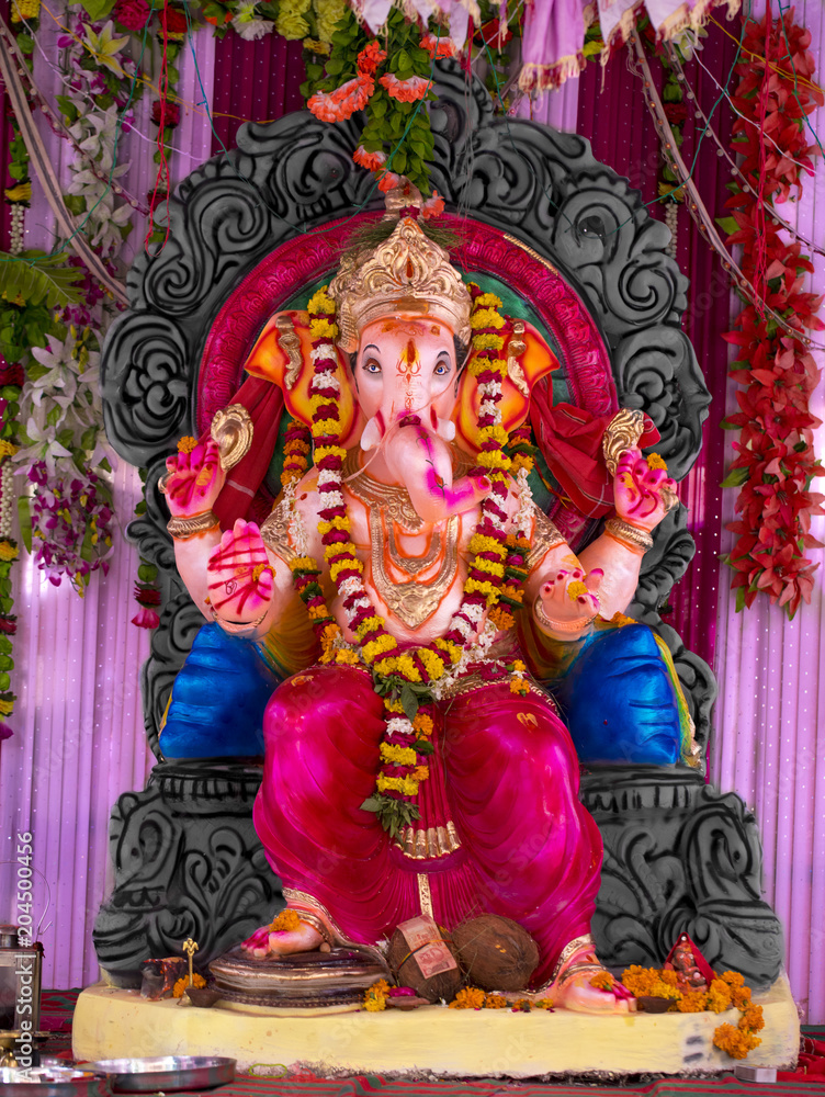 Indian Hindu God Ganesha idol also know as Vinayaka Chaturthi is the Hindu festival, God Ganesha Statue Made of Clay And Coated with Ceramic Colors, Handmade Artistic Effects, Beautiful Artifacts