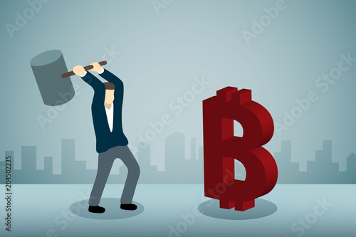 Businessman breaking Bitcoin Sign with hammer