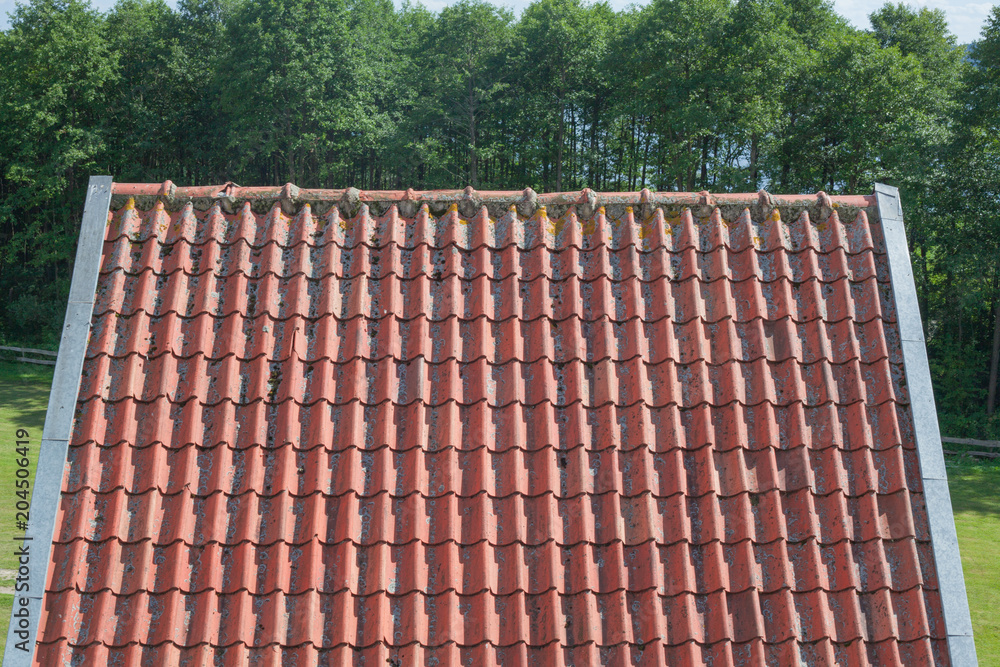 Naklejka premium Red roof on old building