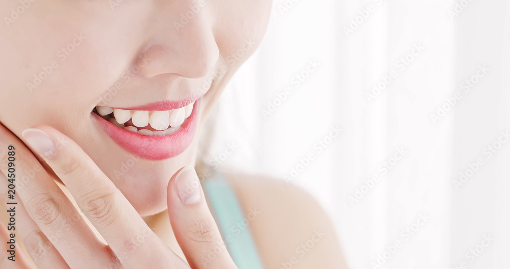 close up woman tooth