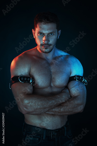 sexy and naked muscular young man standing