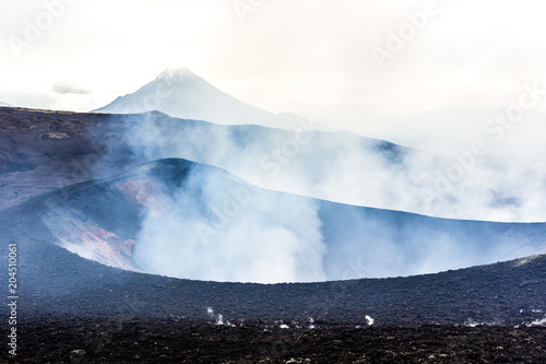 Steaming crater of erupting volcano Tolbachik, Kamchatka Peninsula