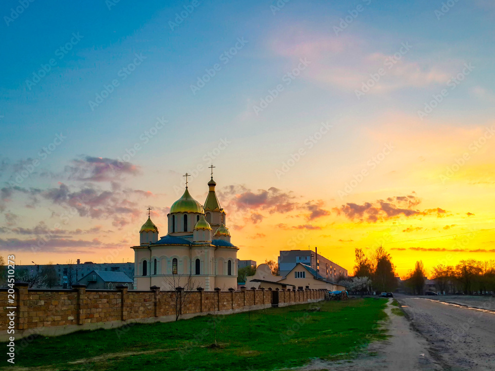 Kovel, Ukraine - April 14, 2018: Church of Resurrection and spectacular spring sunset sky