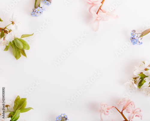Fototapeta Naklejka Na Ścianę i Meble -  Festive flower composition on the white wooden background. Overhead view