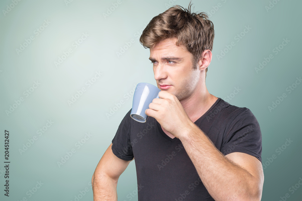 Handsome young man drinking coffee Handsome young man drinking coffee