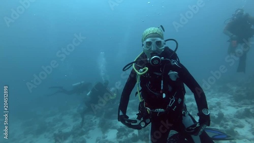 Female scuba diver swim portrays manta ray - Indian Ocean, Maldives
 photo