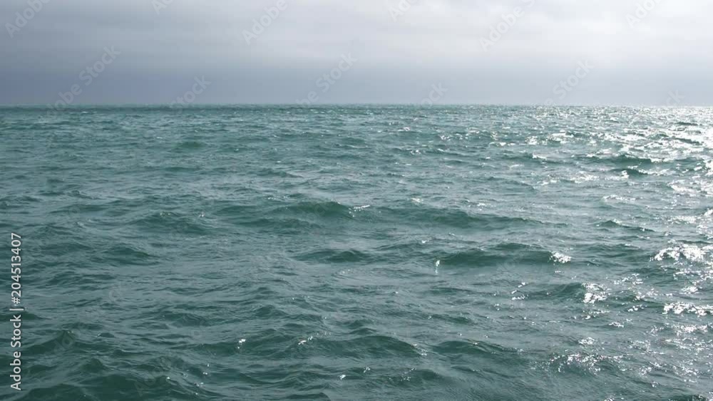 Abstract background of waves on the sea against a cloudy sky background Slow Motion video Abstract background of waves on the sea against a cloudy sky background Slow Motion video